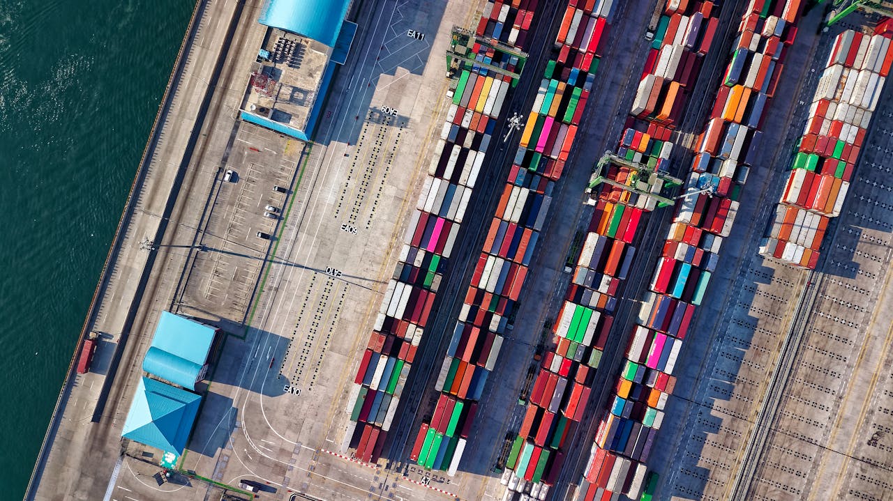 About Top view of colorful shipping containers at a bustling port in Jakarta, Indonesia.